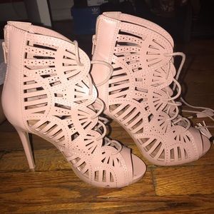 Woman’s pink lace up heel